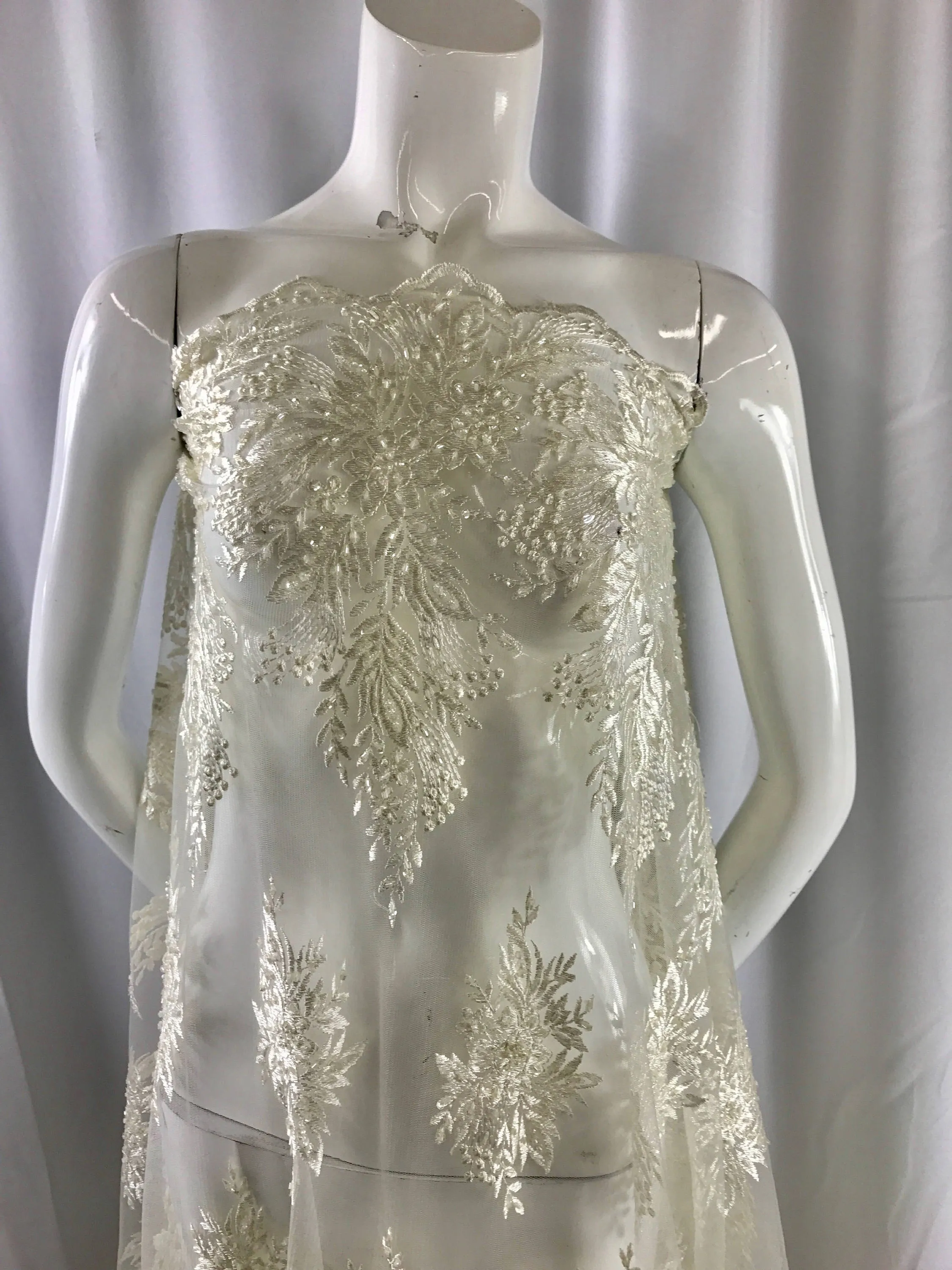 Ivory french design embroider with sequins and hand beaded on a mesh lace-wedding-bridal-prom-nightgown-decorations-sold by the yard.