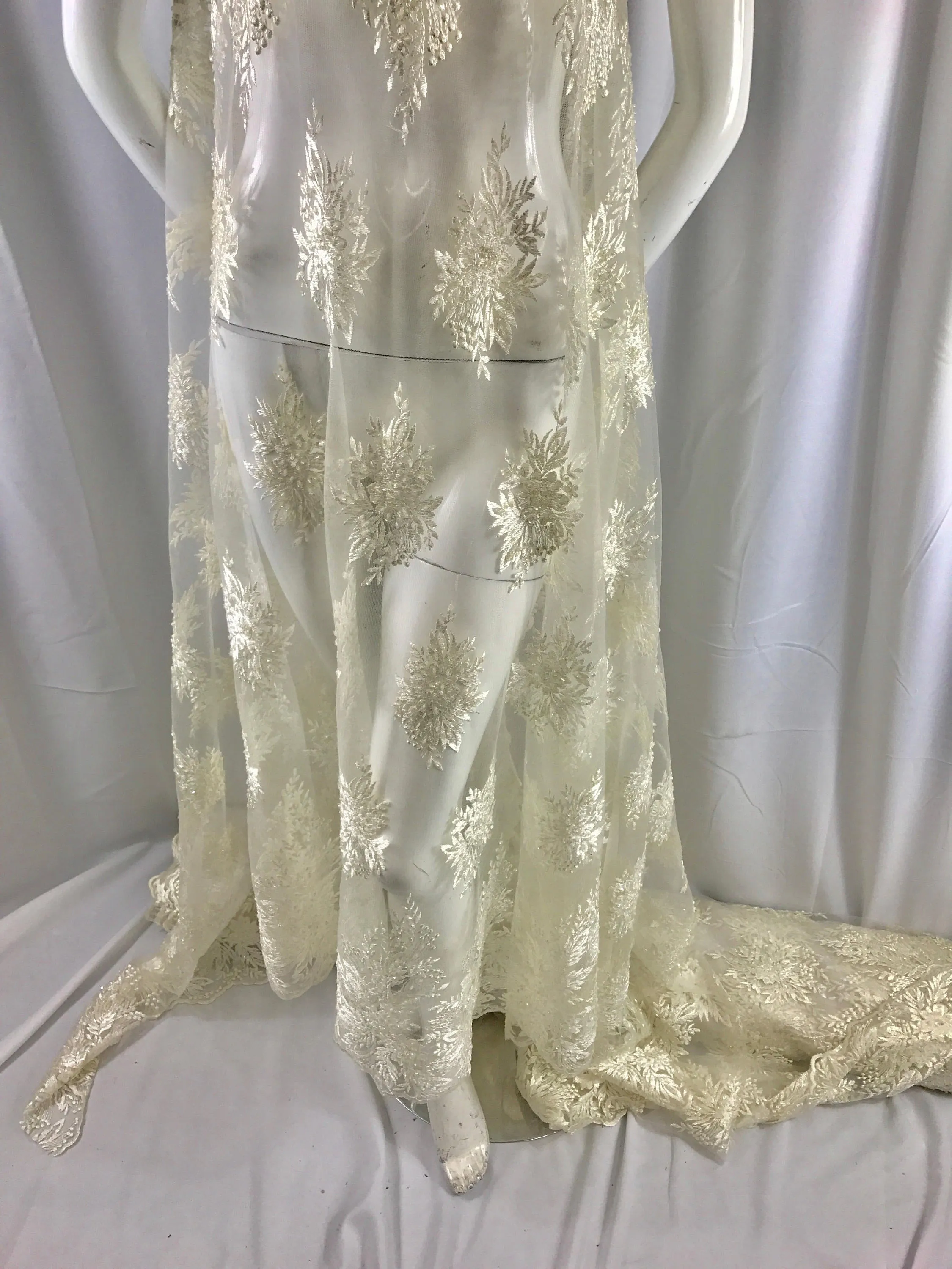 Ivory french design embroider with sequins and hand beaded on a mesh lace-wedding-bridal-prom-nightgown-decorations-sold by the yard.